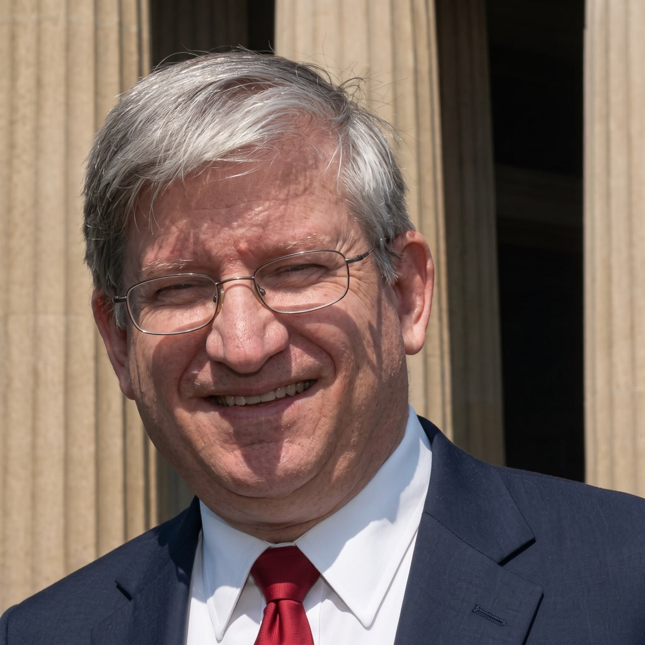 Tom Kimball in front of a courthouse